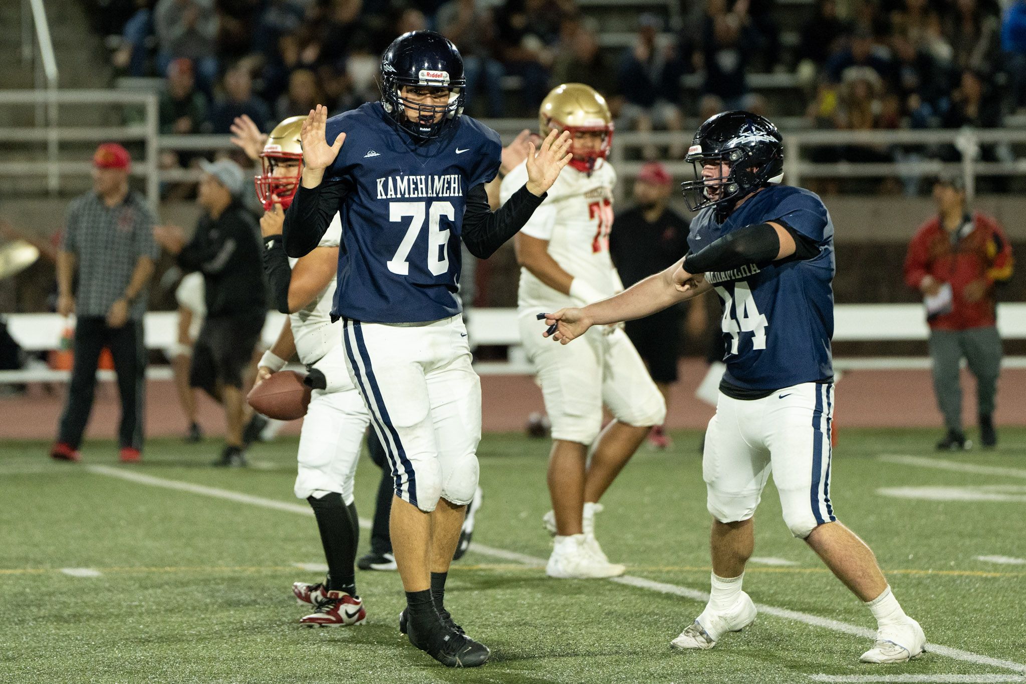 Kamehameha Schools Maui football players Titus Joaquin (76) and Niuhi Howard II celebrate a defending play in their 60-26 win over Roosevelt last week in the Division II state semifinals. Photo courtesy of Kamehameha Schools Maui