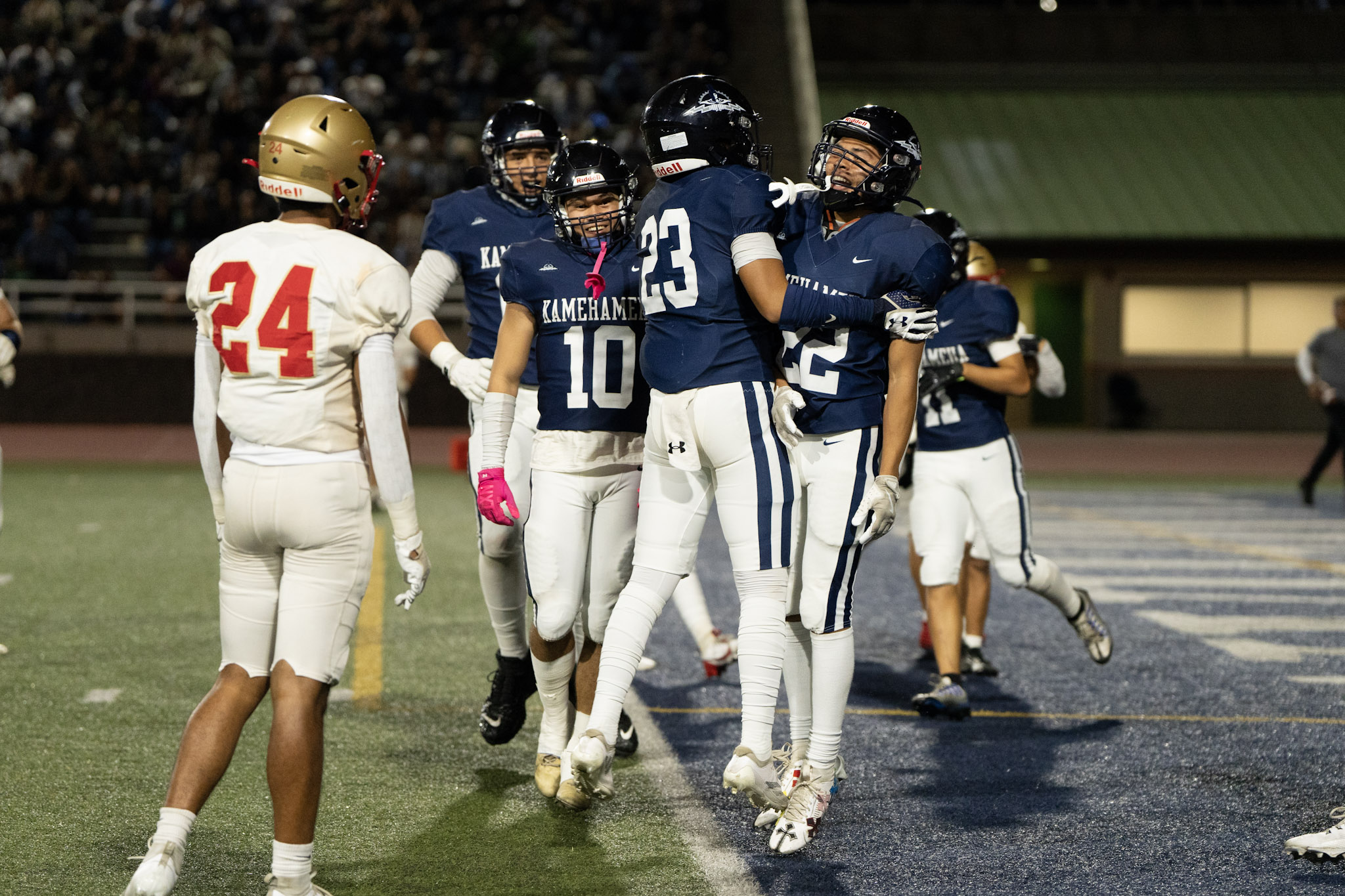 Kamehameha Maui's Bransyn Hong (23) and Zedekiah Campbell (22) chest bump to celebrate Campbell's touchdown run in their 60-26 win over Roosevelt last week. The Warriors face Kaiser for the D-II state championship on Saturday in Mililani. Photo courtesy of Kamehameha Schools Maui