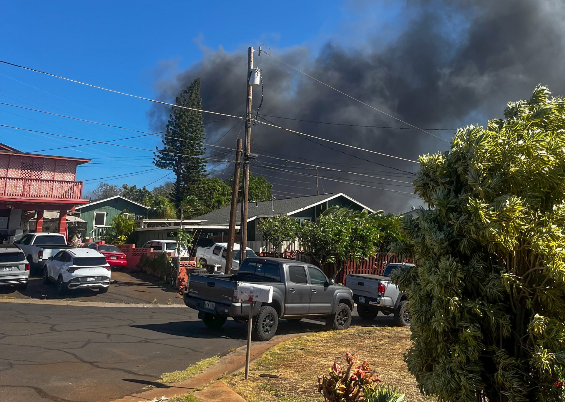 growing Lahaina fire is visible in the distance. Photo: Nate Kahaiali'i