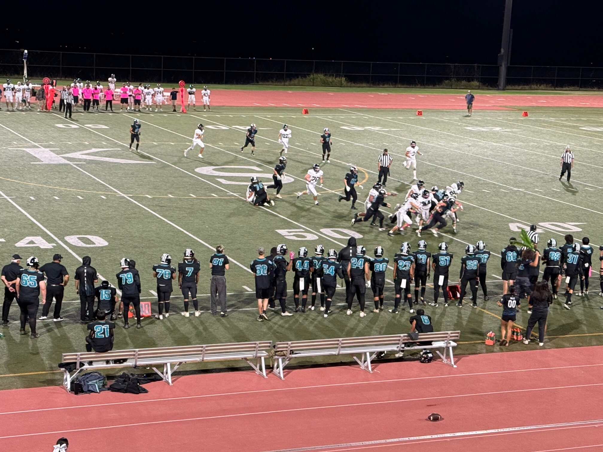 The King Kekaulike High School football team runs a play on Oct. 25 at Kanaiaupuni Stadium. Na Alii won the game 16-14 to force a playoff game between the two for the MIL Division II state berth on Saturday at War Memorial Stadium HJI / ROB COLLIAS photo