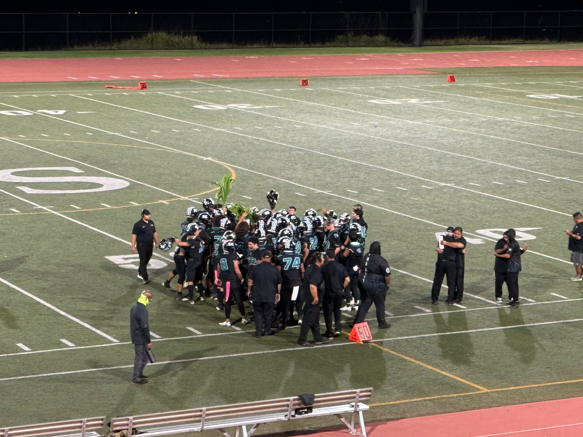 The King Kekaulike football team celebrates prior to the post-game handshake line on Friday at kamehameha Maui. Na Alii defeated the Warriiors 16-14 to force a league championship between the two Saturday at War Memorial Stadium. HJHI / ROB COLLIAS photo