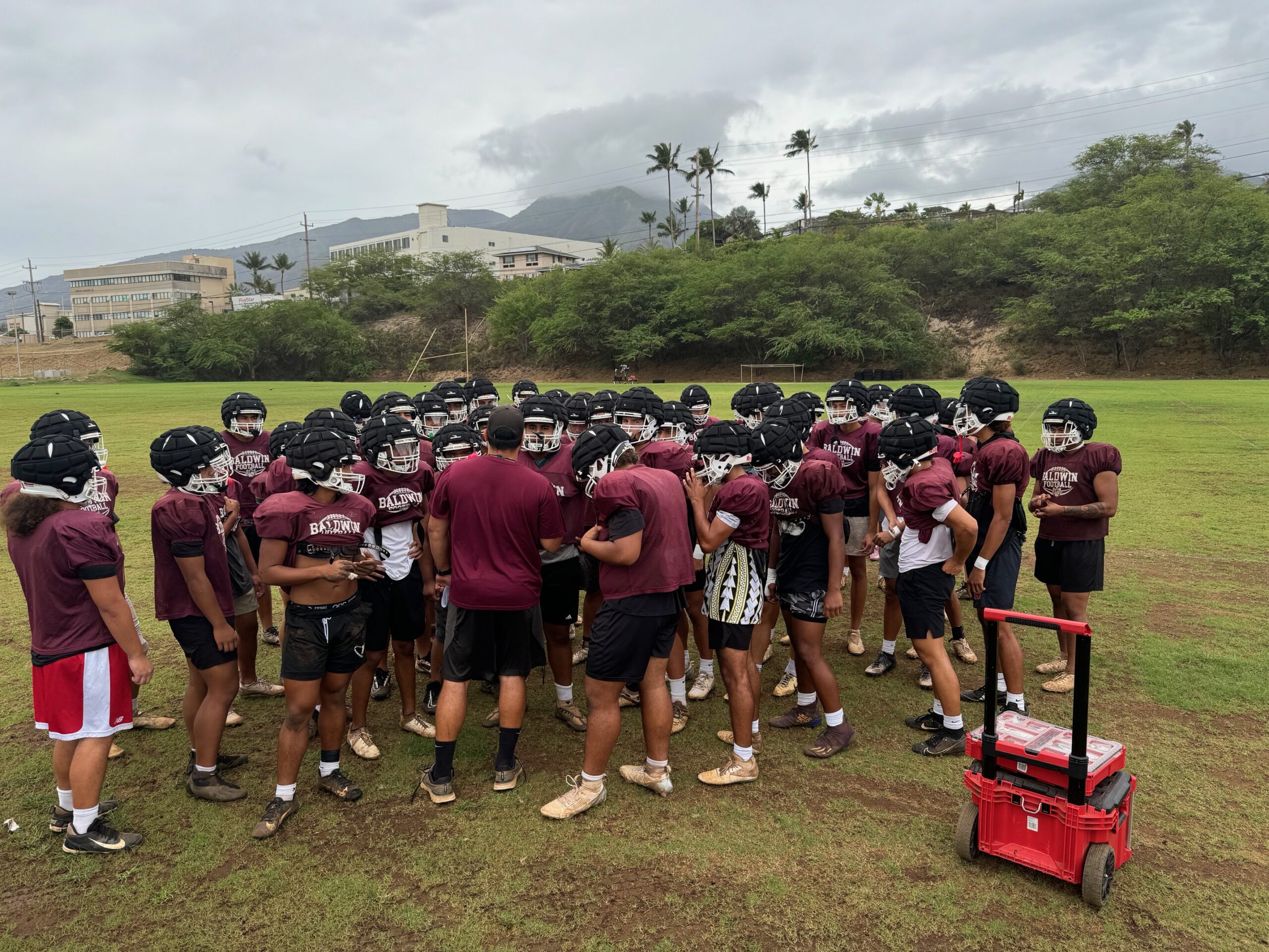 Baldwin High School football coach Cody Nakamura talks with his team before practice on Monday. The Bears will face Lahainaluna for the MIL Division I title on Friday at King Kekaulike Stadium. HJI / ROB COLLIAS photo