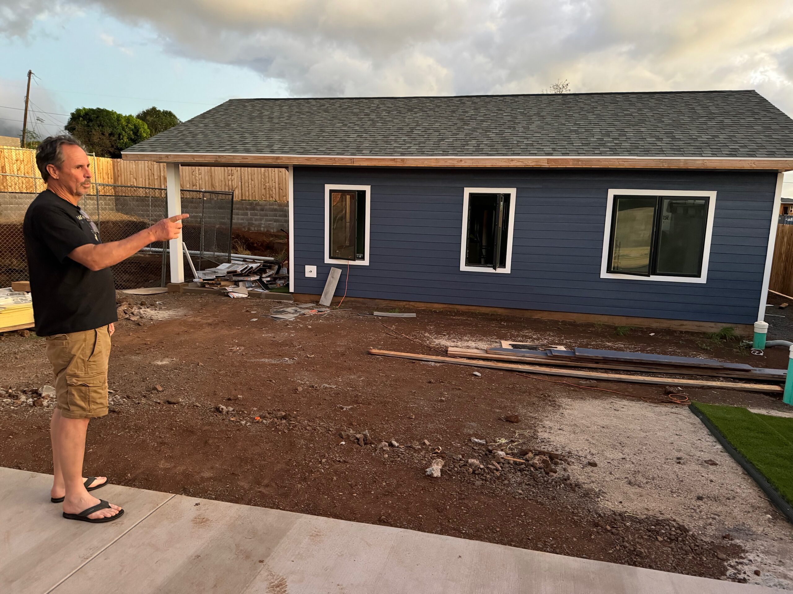 George Milne stands in front of his ohana unit on his Fleming Road property. Milne and wife Joann hope to move from the trailer that they are currently living in on the property to the ohana unit before Christmas. HJI / ROB COLLIAS photo