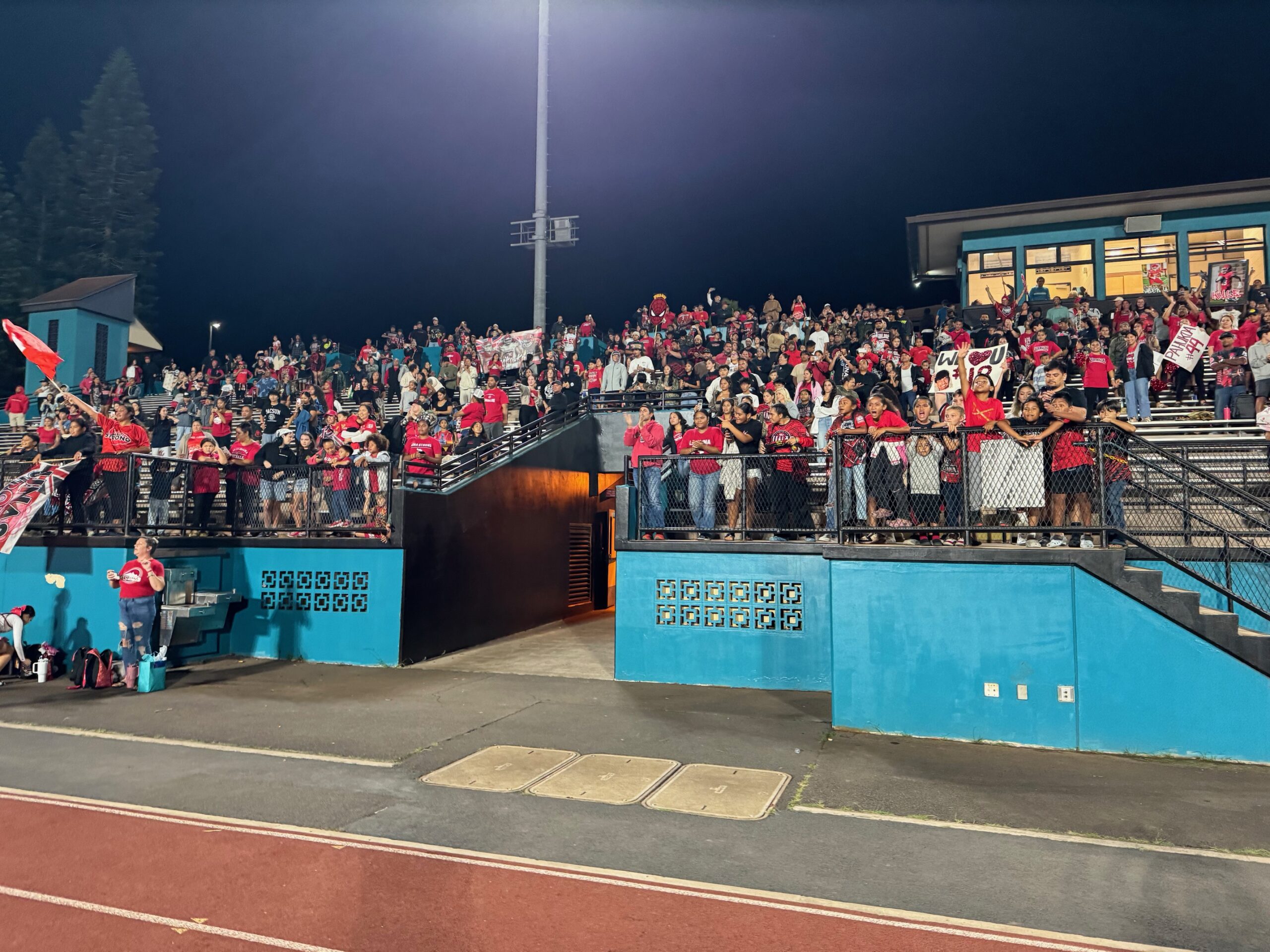 The Lahainaluna crowd salutes the Lunas after a dramatic 7-3 win over Baldwin clinched the school's 17th straight state football berth on Friday at King kekaulike Stadium. HJI / ROBERT COLLIAS photo