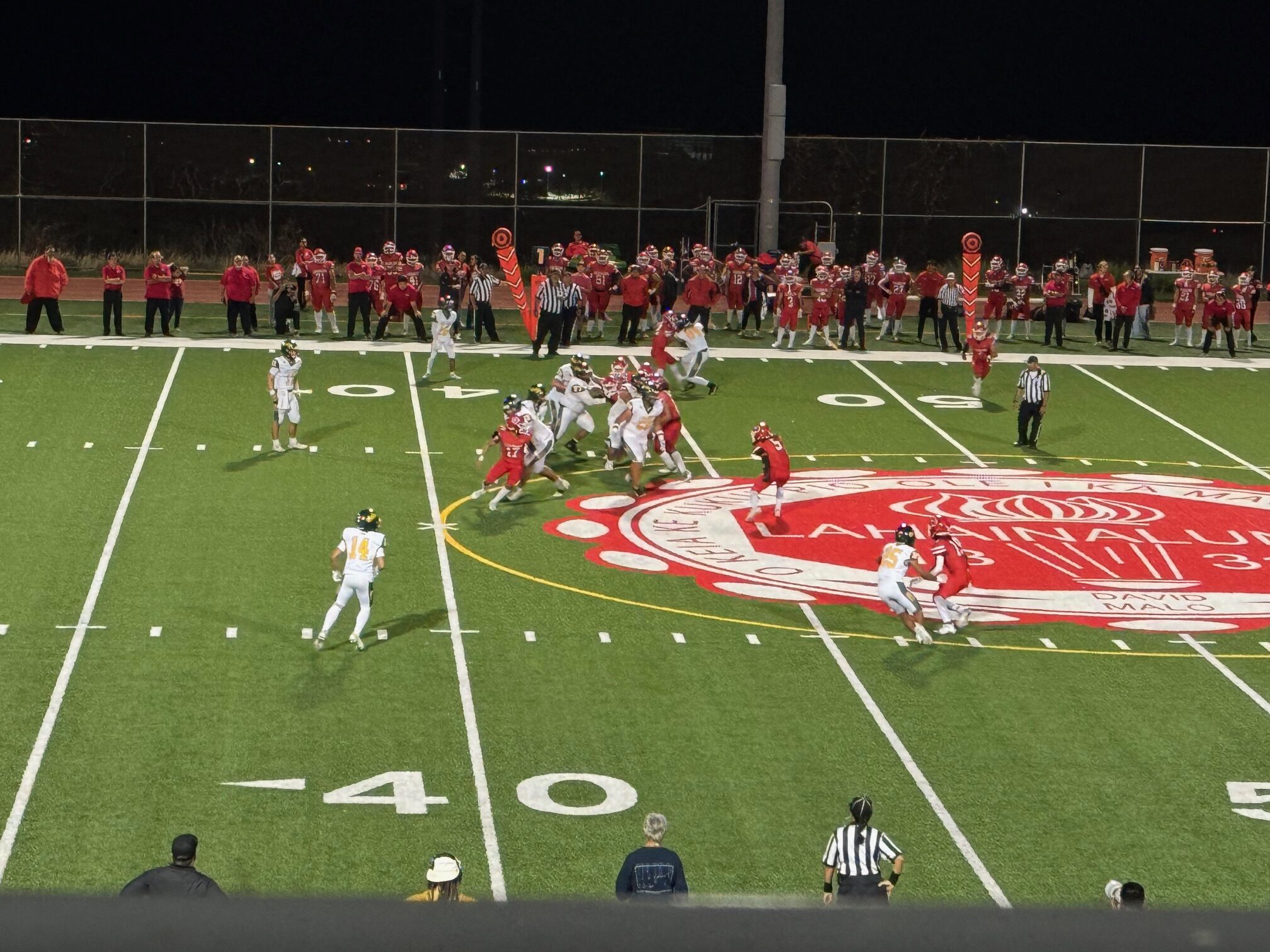 Lahainaluna linebacker Kahi Magno (near L in logo) plays against Leilehua on Saturday in a First Hawaiian Bank/HHSAA Division I quarterfinal game. The Mules eliminated the Lunas 40-13. HJI / ROB COLLIAS photo