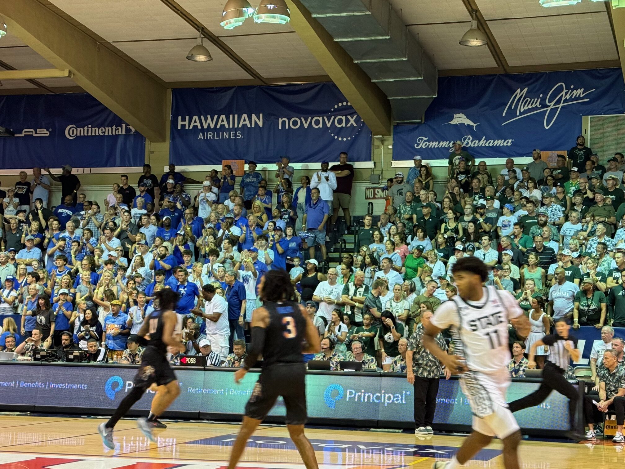 The boosters from Memphis and Michigan State were split down the middle of the bleachers for their game in the Maui Invitational at Lahaina Civic Center on Tuesday. The Tigers won the game 71-63 to advance to today's championship game. HJI / ROB COLLIAS photo