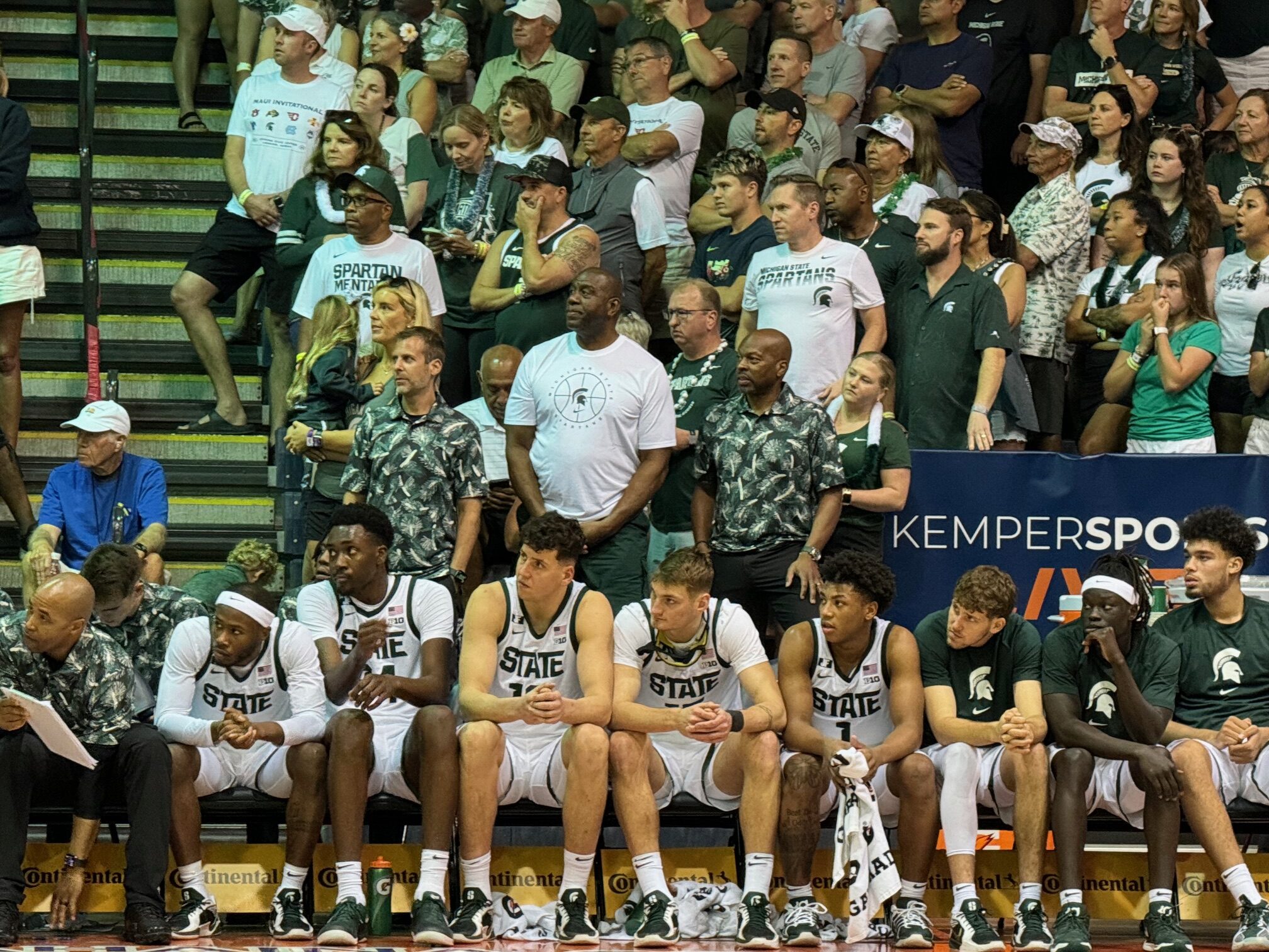 Earvin "Magic" Johnson (white shirt middle) watches his alma mater, Michigan State, on Tuesday in the Maui Invitational at the Lahaina Civic Center. HJI / ROB COLLIAS photo