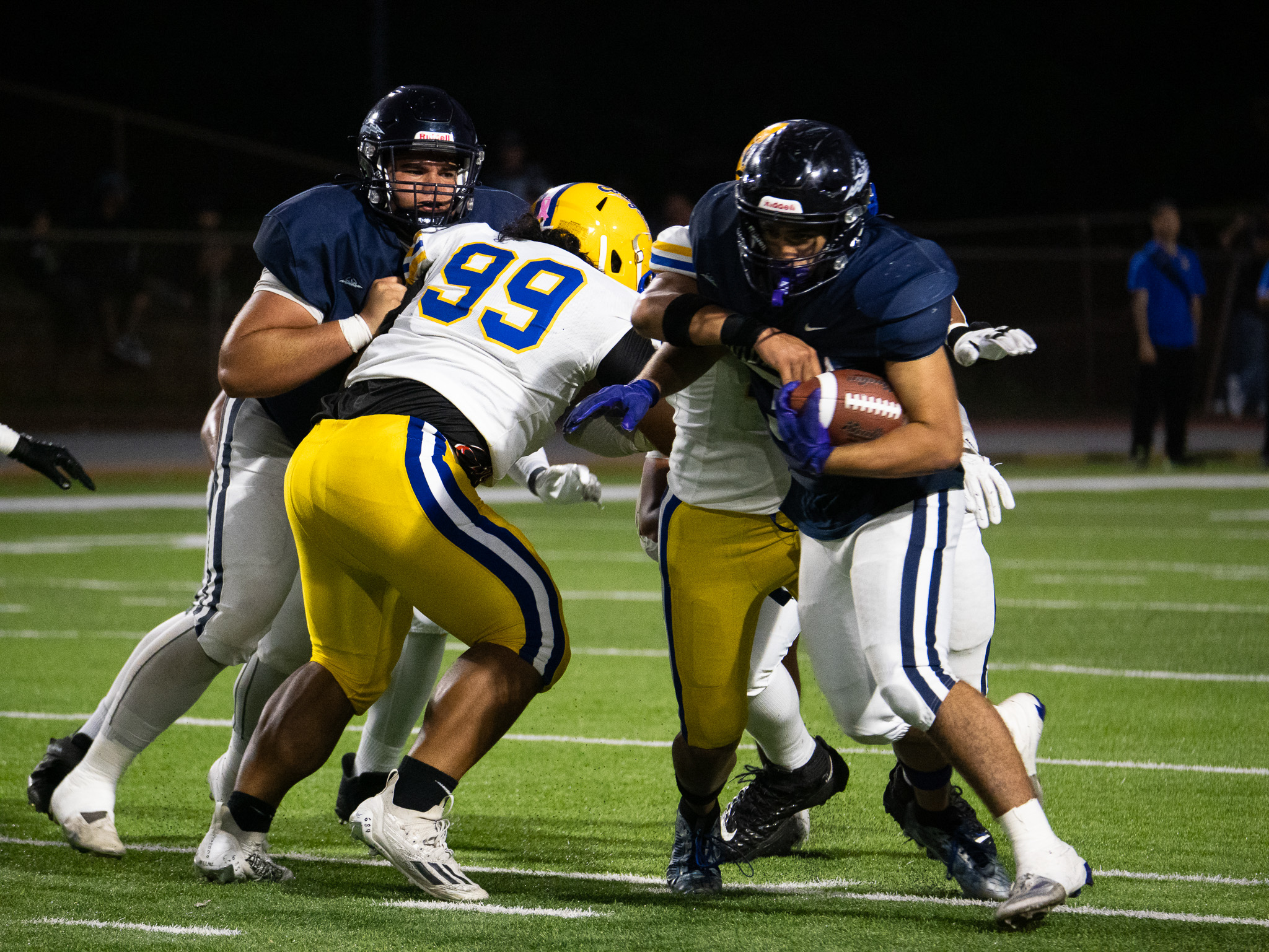 Kaikea Hu'eu of the Kamehameha Maui football state champions runs the ball on Saturday as Pa'u Spencer blocks on the left. The Warriors beat Kaiser 37-14. Photo courtesy of Kamehameha Schools Maui.